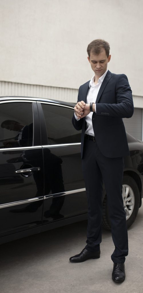 elegant-man-standing-his-car-taxi-services
